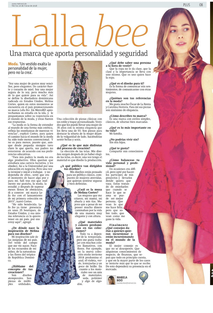 Melina Nmili of Lalla Bee walking on stage with a model during a Boston Voyager interview feature event, greeted by applause from the audience.