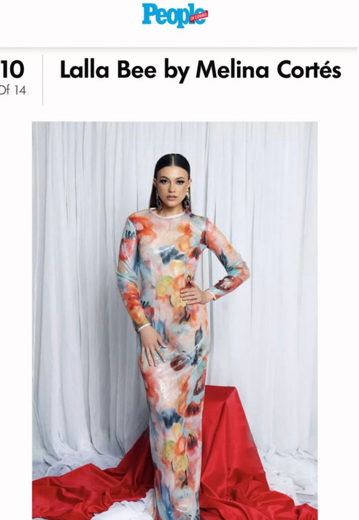 model posing in long custom made gown. featured in people en espanol