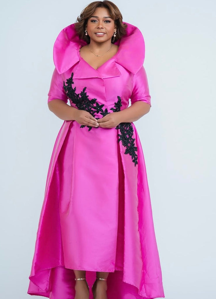 woman posing with pink custom made gown