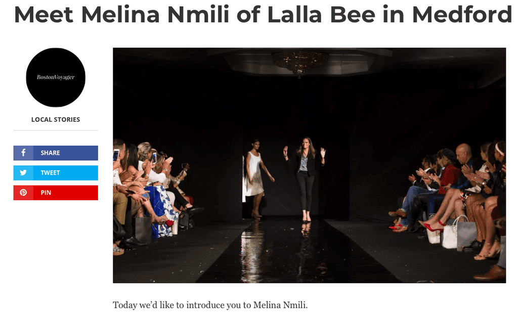Fashion designer Melina Nmili of Lalla Bee walks the runway in Medford during her Boston Voyager feature, greeted with applause from the audience.