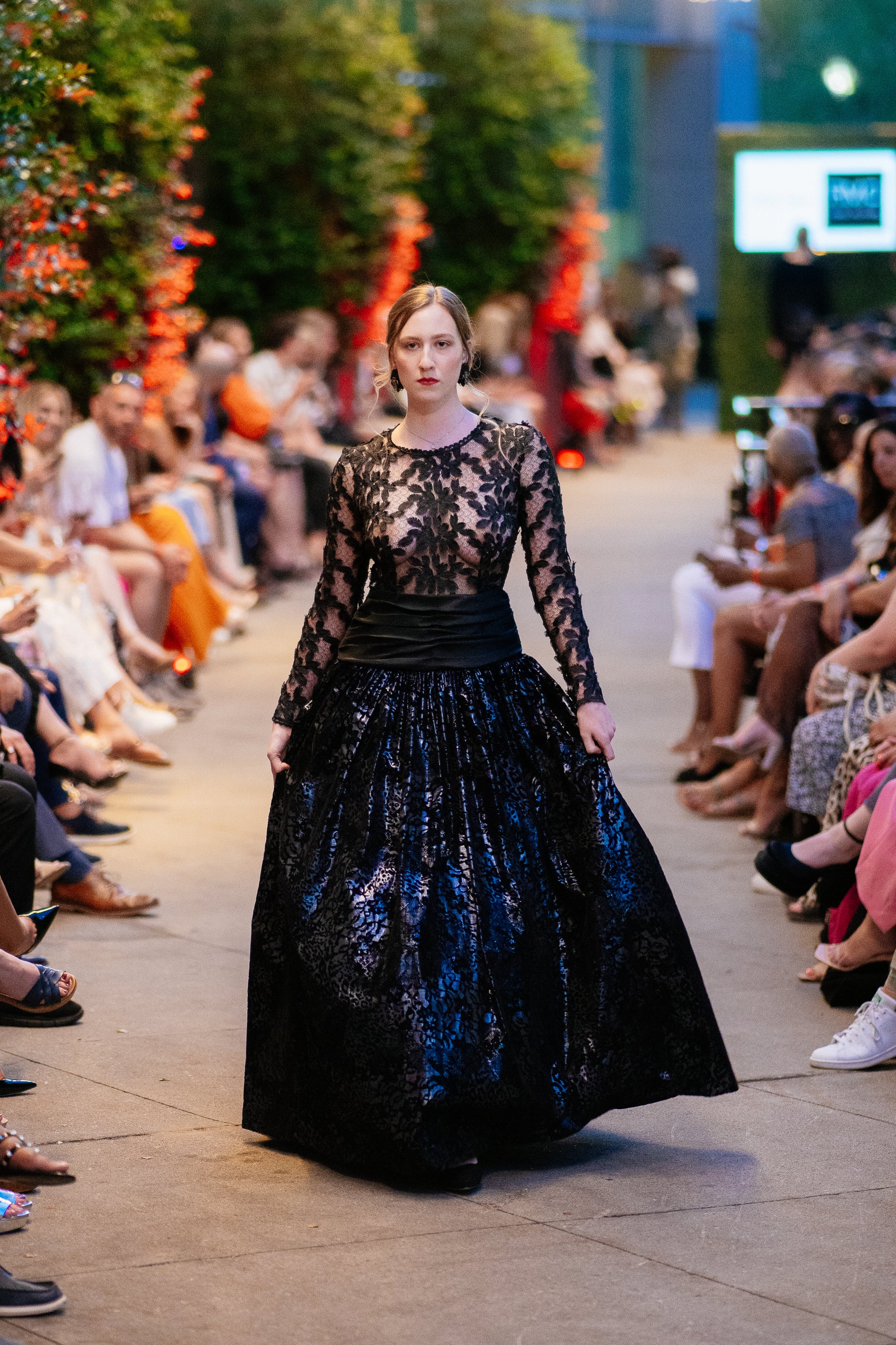 Model wearing the Lalla Bee Lace Velvet custom design gown featuring a black lace bodice and voluminous velvet skirt, ideal for galas and formal events.