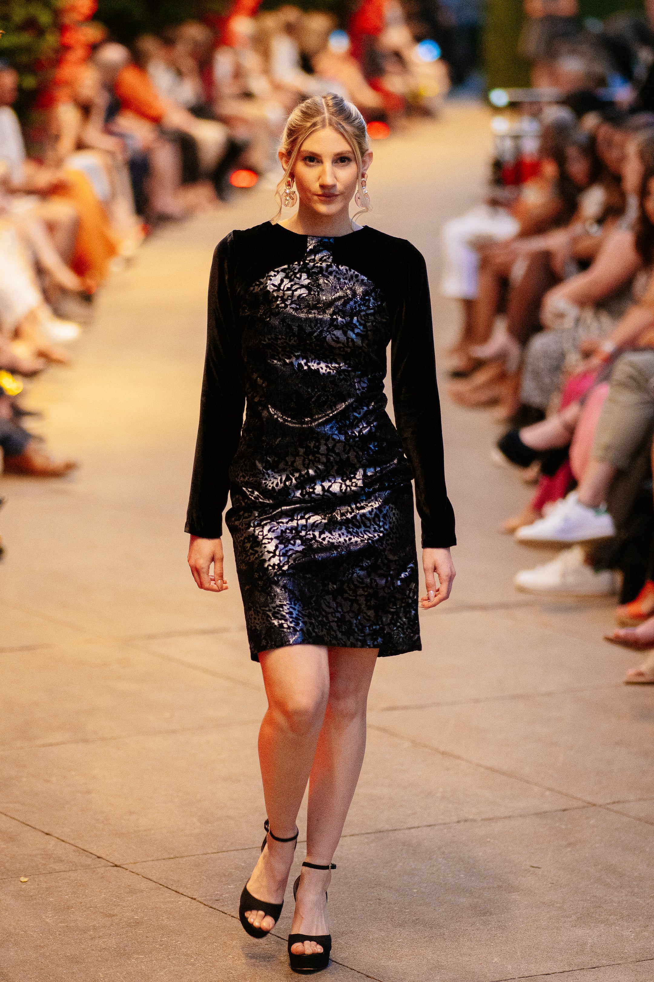 Model wearing the Lalla Bee Metal Velvet custom design dress featuring a shimmering metallic velvet pattern with long sleeves and a sleek mini silhouette, ideal for special occasions.
